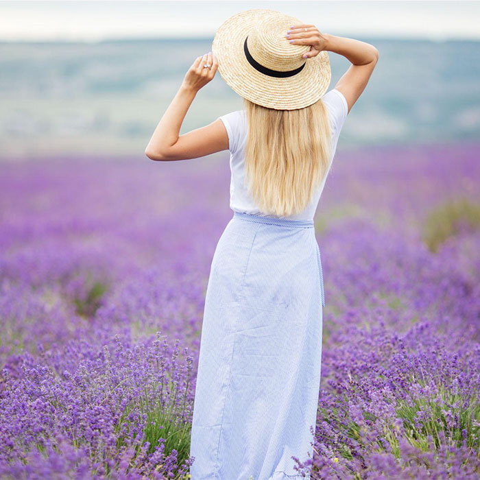 woman looking out at lilac field